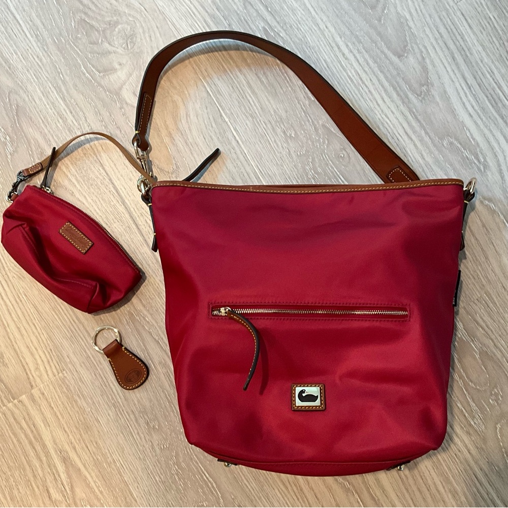 Like new!!!!!  Never used !!! 

Dooney & Bourke Purple and Pink